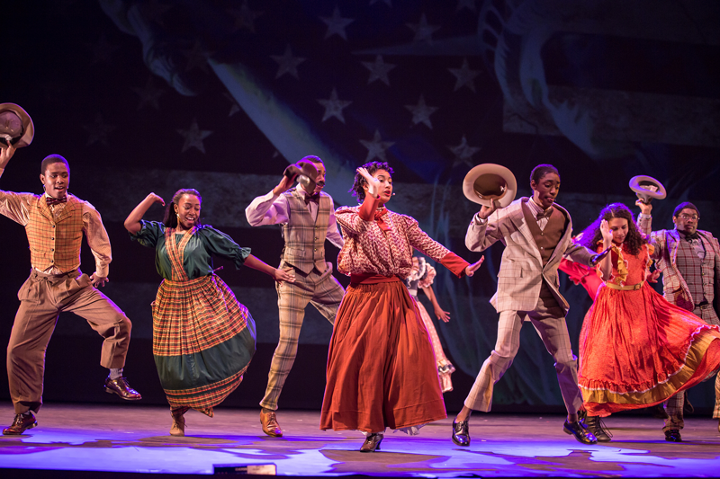Students performing on stage