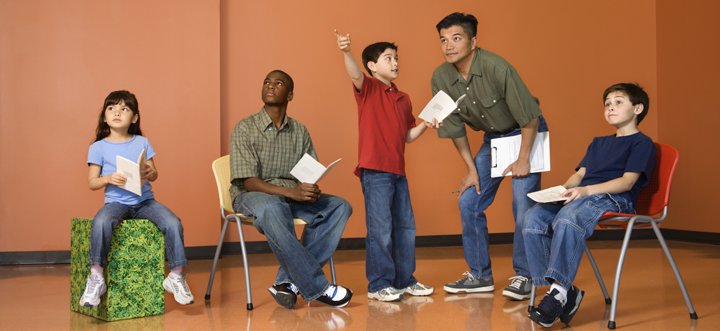 Image of students and teacher rehearsing
